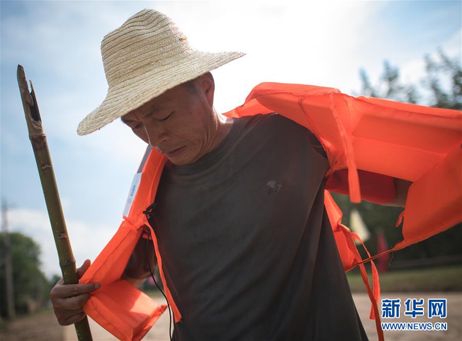 (防汛抗洪·图片故事)(3)“火神山”建设者忙碌在抗洪一线