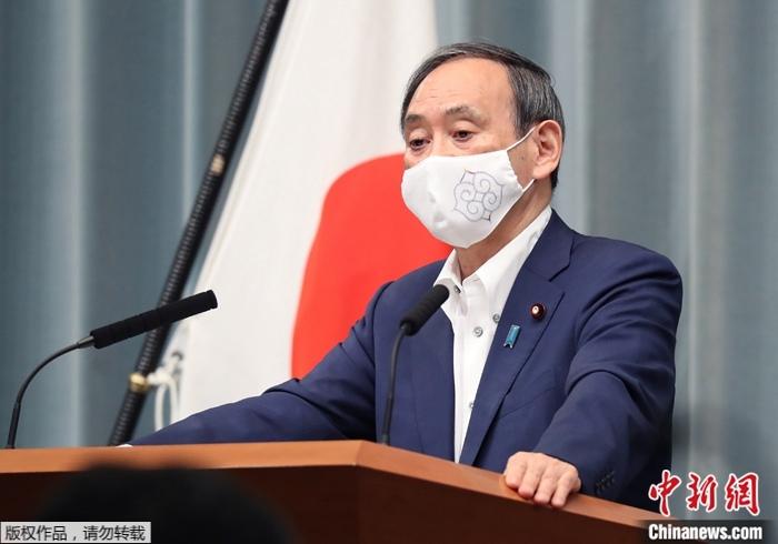 资料图为日本首相菅义伟。 点击进入下一页