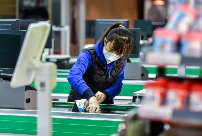国际社会看中国优化疫情防控措施